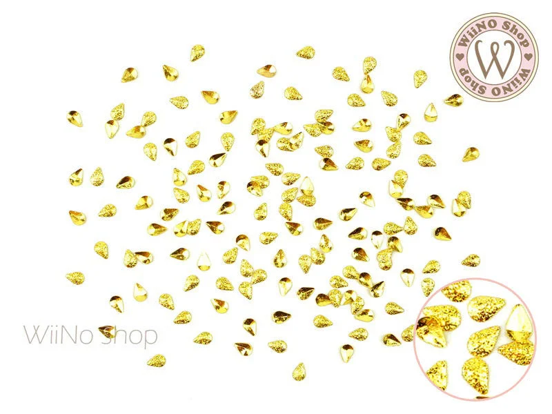 Salon-quality nail gel-2 x 3mm Gold Textured Drop Metal Studs - 25 pcs